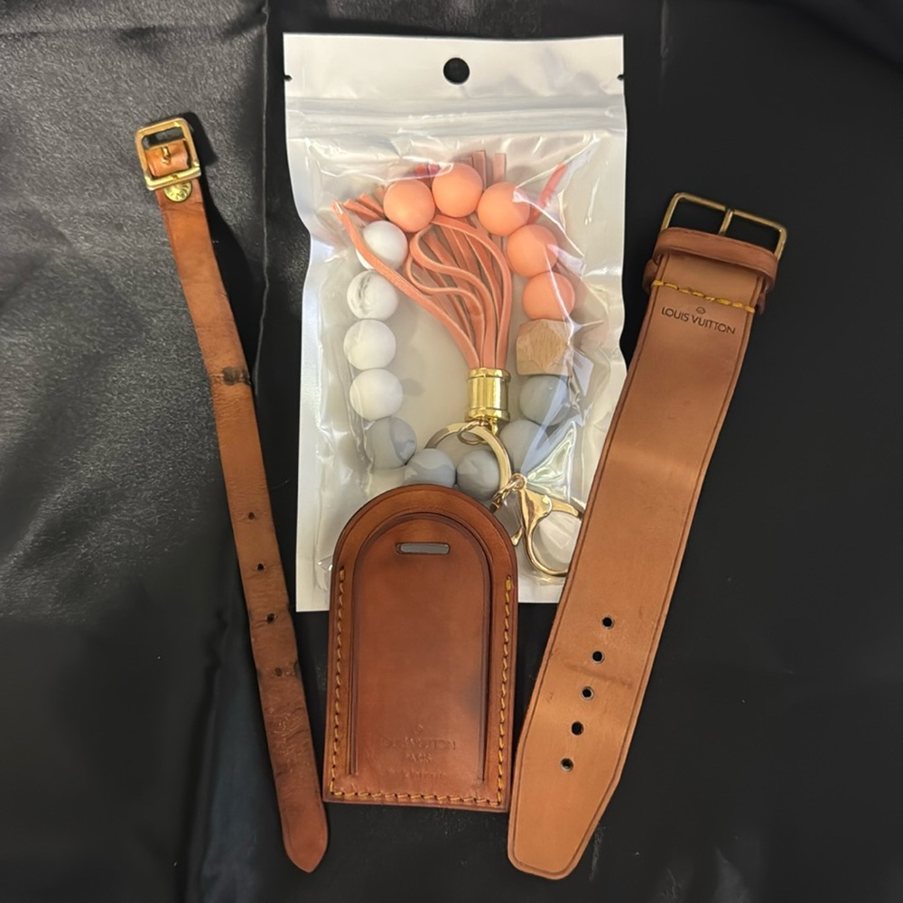 Louis  Vuitton tan and orange luggage tag.